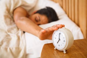 Sleeping woman alarm clock